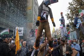 Iran-Burning U.S. And Israeli Flags And Effigy In Anniversary Rally