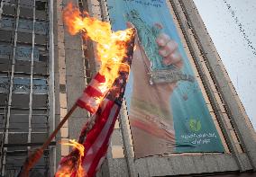 Iran-Burning U.S. And Israeli Flags And Effigy In Anniversary Rally
