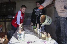 Making of tin can lamps for Ukrainian military in Kyiv Region