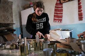 Making of tin can lamps for Ukrainian military in Kyiv Region