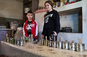 Making of tin can lamps for Ukrainian military in Kyiv Region