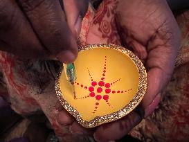 Decorating Clay Diwali Diyas In Preparation For The Diwali Festival