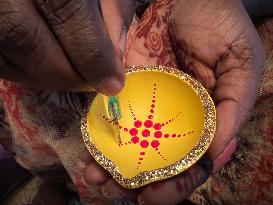 Decorating Clay Diwali Diyas In Preparation For The Diwali Festival