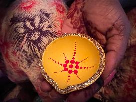 Decorating Clay Diwali Diyas In Preparation For The Diwali Festival