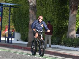 Arnold Schwarzenegger Rides A Bike - LA