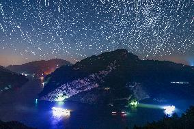 Boats Sailing Along The Yangtze River at Night in Yichang