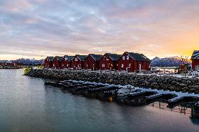 Traditional Rorbuer At Sunrise In The Lofoten Islands