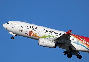 Shenzhen Airlines Airbus with Creative Fashion Capital livery taking off from Barcelona