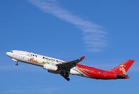 Shenzhen Airlines Airbus with Creative Fashion Capital livery taking off from Barcelona