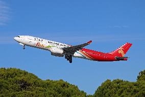 Shenzhen Airlines Airbus with Creative Fashion Capital livery taking off from Barcelona