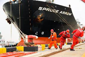 Workers Pull A Cable at Zhenghe International Terminal in Suzhou