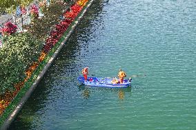 Sanitation Workers Clean A River in Shanghai