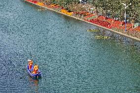 Sanitation Workers Clean A River in Shanghai