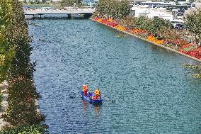 Sanitation Workers Clean A River in Shanghai