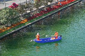 Sanitation Workers Clean A River in Shanghai