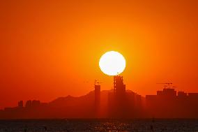 Fishing Boats Sailing at Sunset in Qingdao