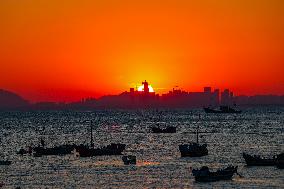 Fishing Boats Sailing at Sunset in Qingdao