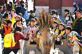 Tourists Visit The Forbidden City in Beijing