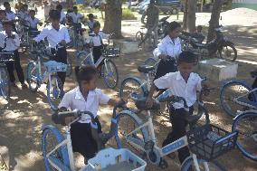 CAMBODIA-KAMPONG CHHNANG-CHINESE-DONATED BICYCLES-STUDENTS