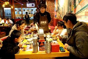 Consumers Eat Shabu at A Restaurant