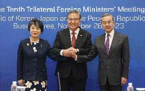 Top diplomats of Japan, South Korea and China