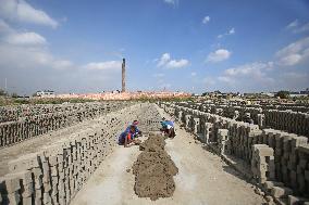 Laborers Work At A Brickyard - Bangladesh