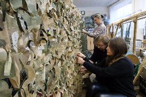 Kyiv Region volunteers make camouflage nets and uniforms for Ukrainian military