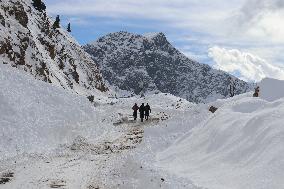 People Walk On A Snow Covered Mughal Road After Fresh Snowfall
