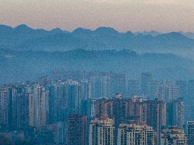 Buildings Loom in The Mist in Bijie