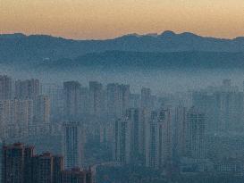 Buildings Loom in The Mist in Bijie