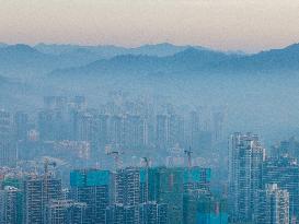 Buildings Loom in The Mist in Bijie