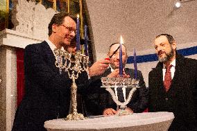 Prime Minister Hendrik Wuest Light The Candles During The First Day Of Hanukkah