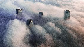 High-rise Buildings Shrouded in Mist