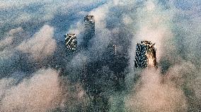 High-rise Buildings Shrouded in Mist