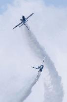 Blue Impulse aerobatic team flies over Okinawa