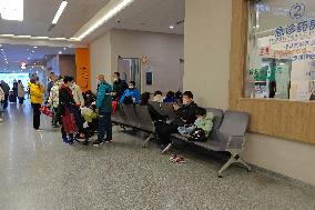 Parents Take Children to See A Doctor in Shanghai