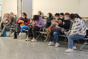 Parents Take Children to See A Doctor in Shanghai