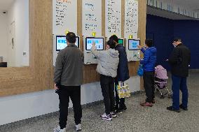 Parents Take Children to See A Doctor in Shanghai