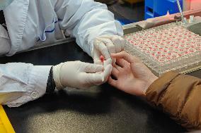 Parents Take Children to See A Doctor in Shanghai