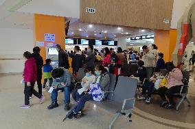 Parents Take Children to See A Doctor in Shanghai