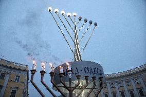 Lighting menorah candle in Odesa