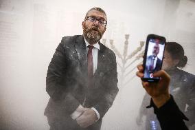 Far-right Polish MP Extinguishes Hanukkah Candle In Parliament