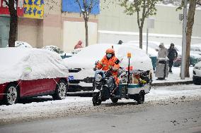 A Courier Rides During Heavy Snow in Beijing