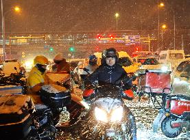 Courier Working Braves Snow in Beijing