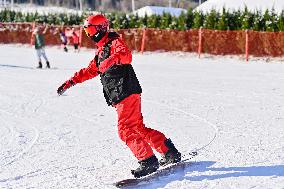 Tourists Skiing at Ski Resort in Qingzhou