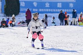 Tourists Skiing at Ski Resort in Qingzhou
