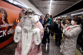 Illuminated Santa Claus Traveling  On  The Mexico City Metro