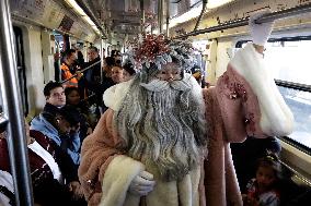 Illuminated Santa Claus Traveling  On  The Mexico City Metro