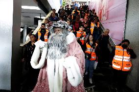 Illuminated Santa Claus Traveling  On  The Mexico City Metro