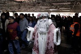 Illuminated Santa Claus Traveling  On  The Mexico City Metro